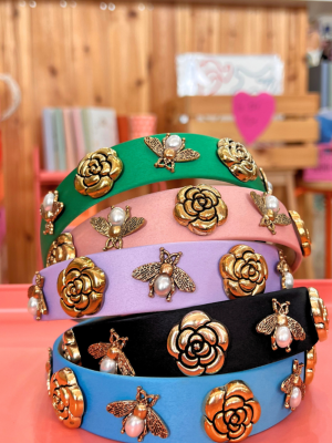 Satin headbands iwith metal elements.